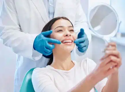 Girl smiling after gum disease treatment palm beach gardens