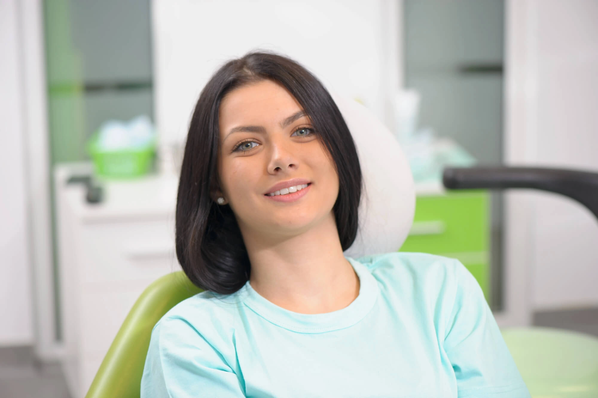 Girl smiling after surgery by a periodontist palm beach gardens