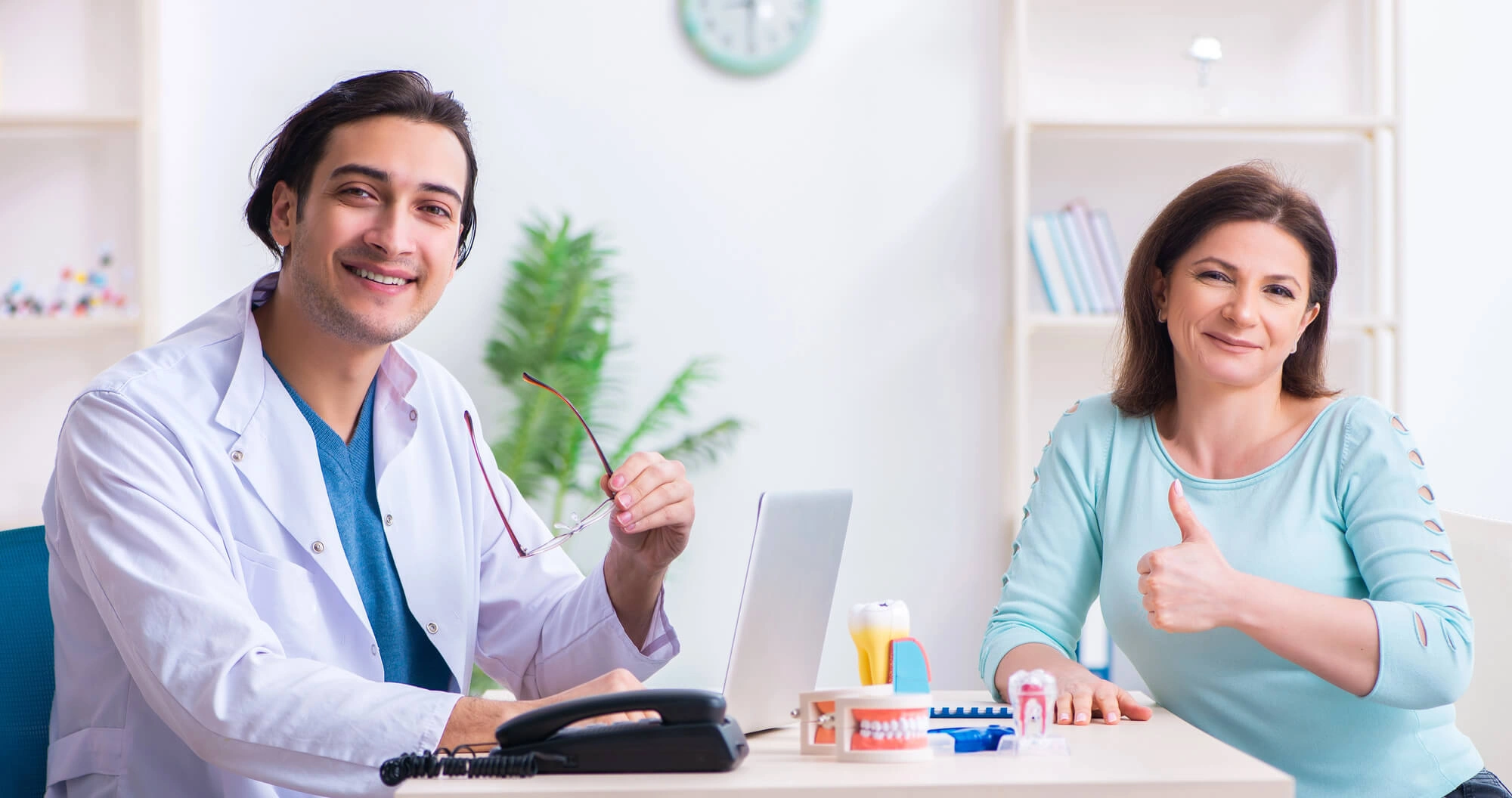 Girl smiling with her periodontist palm beach gardens