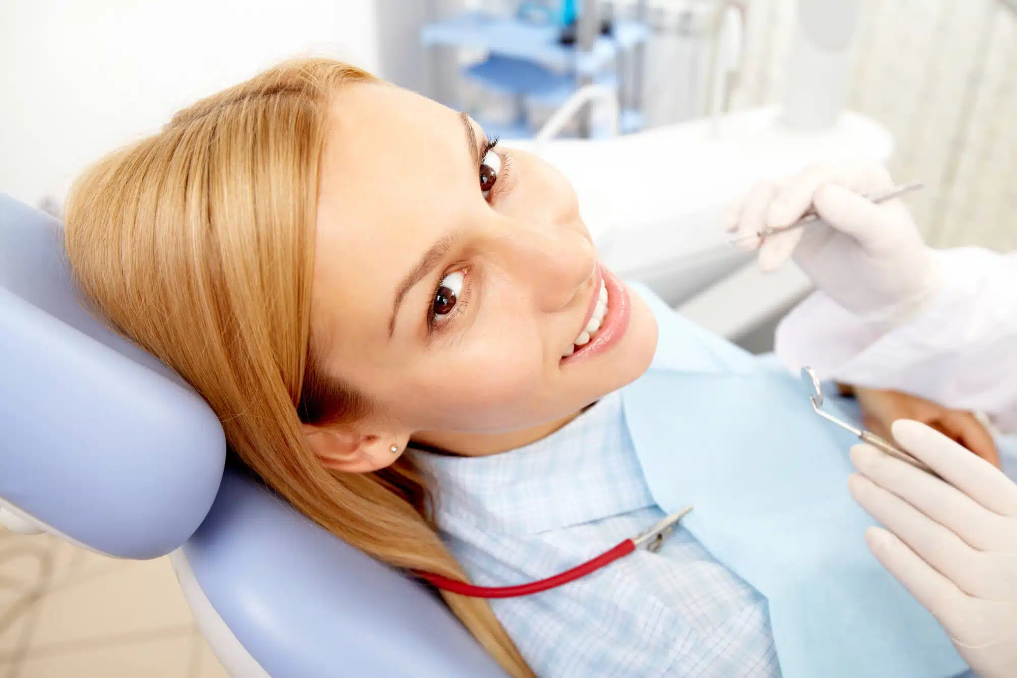 Woman smiling after osseous surgery palm beach gardens
