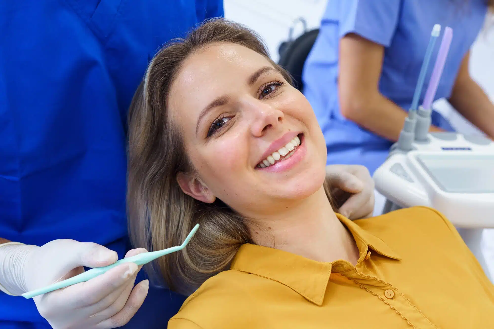 Woman-smiling-after-osseous-surgery-palm-beach-gardens